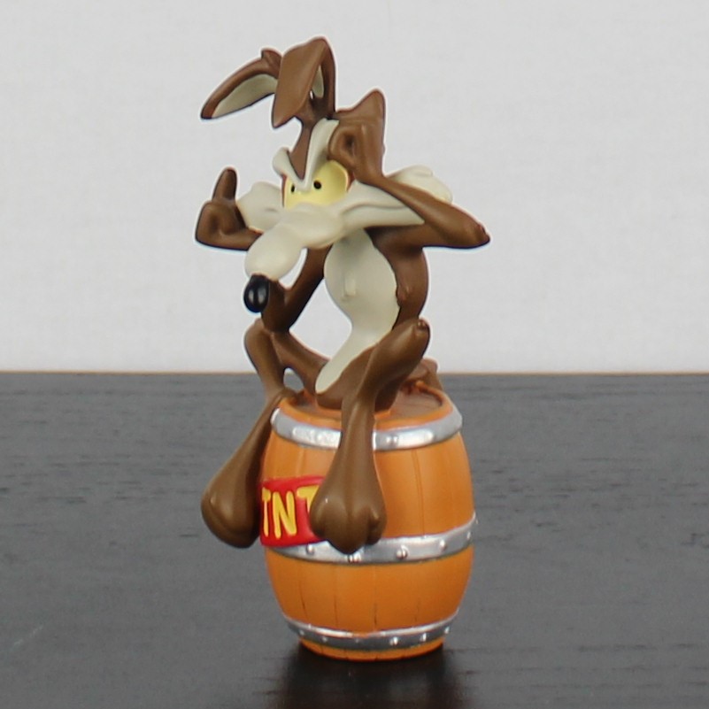 Wile E Coyote sitting on a TNT barrel figurine _left front