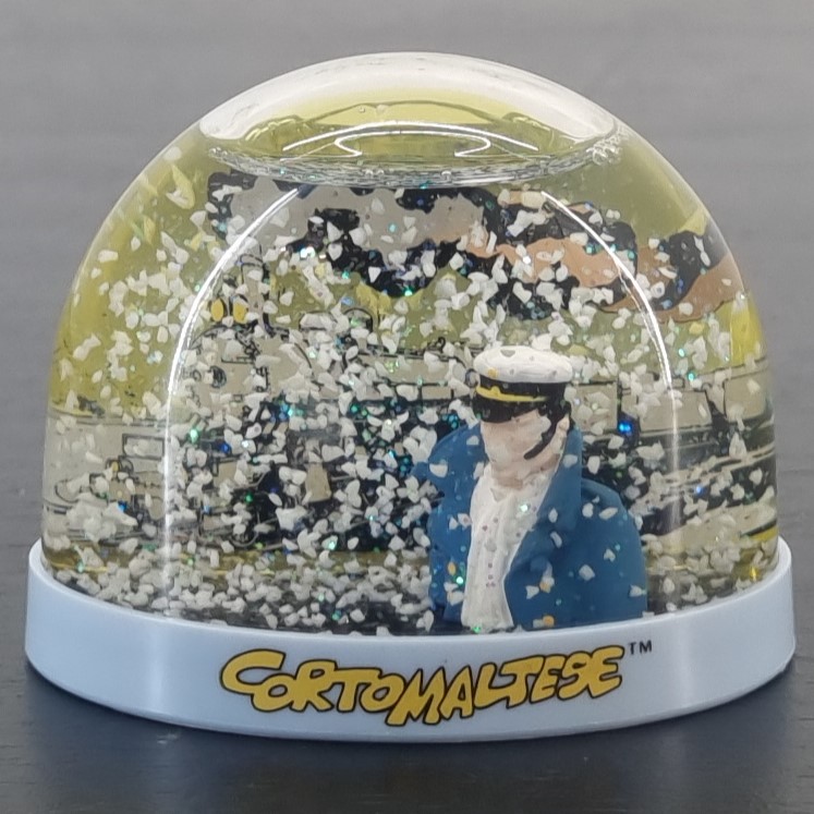 Corto Maltese snowglobe - Demons et Merveilles _front - Demons & Merveilles Corto Maltese snowglobe - Demons et Merveilles _front
