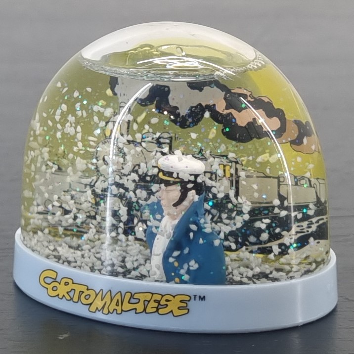 Corto Maltese snowglobe - Demons et Merveilles _left front - Demons & Merveilles Corto Maltese snowglobe - Demons et Merveilles _left front